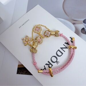 Pandora Pink and Gold Braided Charm Bracelet with Floral Charms